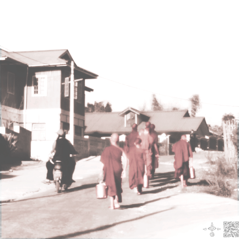 Monks carrying watering cans city street Myanmar.